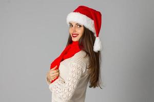 girl in santa hat and red scarf photo