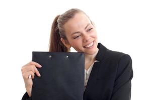 Portrait of a remarkable young business-blondes who laughs and keeps the Tablet near the face closeup photo