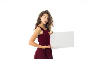 girl in red dress with white placard photo