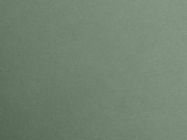 Olive green color velvet fabric texture used as background. light Olive green fabric background of soft and smooth textile material. There is space for text. photo