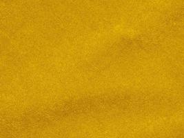 yellow velvet fabric texture used as background. Empty yellow  fabric background of soft and smooth textile material. There is space for text photo