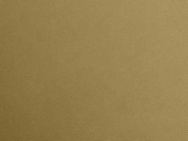 gold color velvet fabric texture used as background. blond color fabric background of soft and smooth textile material. There is space for text. photo