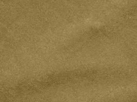 gold color velvet fabric texture used as background. blond color fabric background of soft and smooth textile material. There is space for text. photo