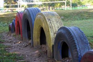 Car tires are painted in various beautiful colors. put together It's a toy in the playground. Let children play to enhance learning development according to the principles of Brain-Based Learning. photo