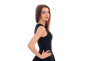 charming young woman with red lips posing and looking at the camera isolated on white background in studio photo