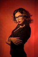 Sexy young secretary in glasses and red lips photo