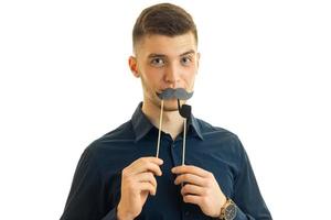 gay young guy Hamming in camera with paper mustache photo