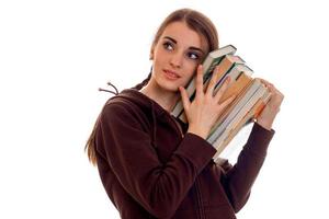 pretty young students girl with books in her hands isolated on white background photo