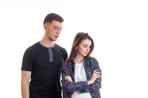 young guy standing next to the wronged girl who looks down photo