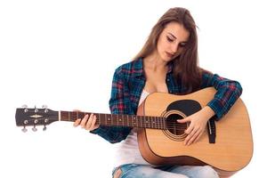 young brunette lady with guitar photo