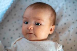 closeup portrait of a beautiful little baby girl photo