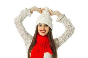 brunette girl in warm sweater and red scarf photo