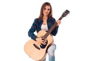 gorgeous girl with guitar in hands photo