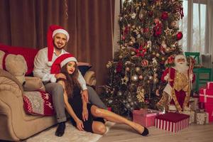Happy young couple celebrate Christmas and New year photo