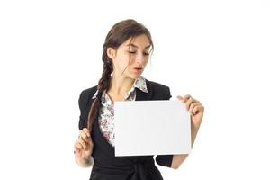 woman in uniform with white placard in hands photo