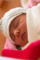 Portrait of a cute newborn girl photo