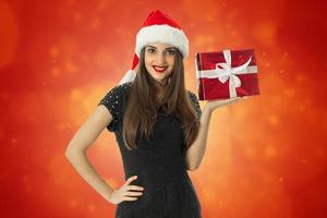 beautiful Girl in santa hat with smiling photo