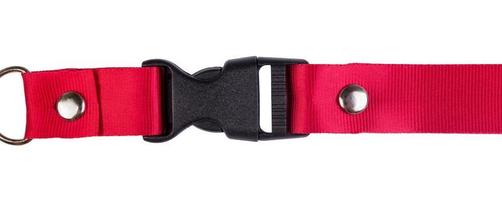 Closed black plastic side release buckle with red woven strap attached photo