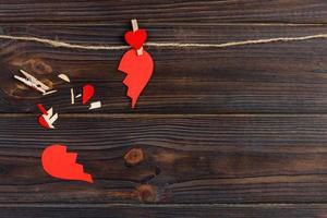 Broken heart breakup collection and divorce icon. Red paper shaped as a torn love , health care problems due to illness. Broken love concept photo