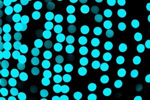 Unfocused abstract colourful bokeh black background. defocused and blurred many round blue light photo