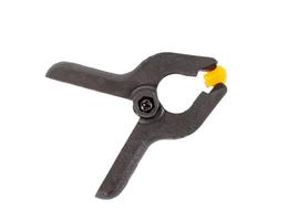 Universal plastic black-orange clamp isolated photo