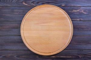 pizza cutting board at table background, Round board photo