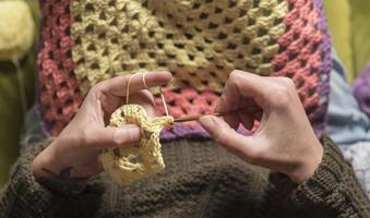 unrecognizable woman knitting photo