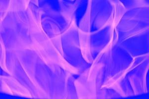 Abstract pink-violet reflections of light, flame, smoke, blurred on a blue background. Bright colored background. photo