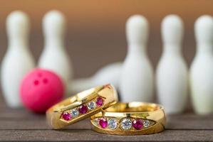 Wedding rings with bowling pin photo