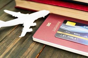 Credit card put on passport on wooden table photo