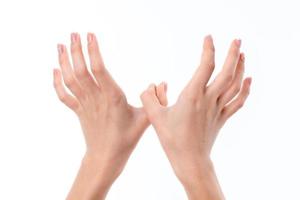 two female hands outstretched forward with raised upward photo