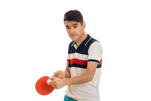 concentrated sportsman practicing ping-pong isolated on white background photo