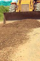 Construction of road paving with gravel soil. photo