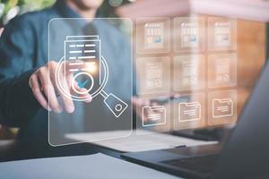 Businessman Audit documents, quality assessment management With a checklist, business document evaluation process, market data report analysis and consulting, review process correctness of document photo