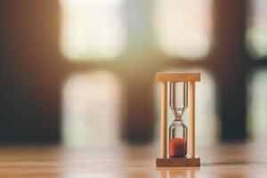 The hourglass is on the table, time management concept,effective business planning,time management in the organization,Agreement and solution,decision making schedule,end of the deal photo