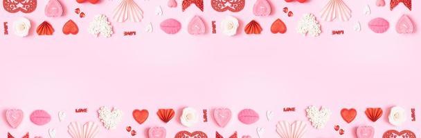 Banner with pattern from hearts and valentines day symbols elements top view. Creative valentines day flat lay background photo