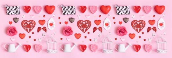 Banner with pattern from different hearts and Valentine's day symbols elements top view. Creative Valentines day flat lay pattern banner photo