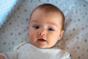 closeup portrait of a beautiful little baby girl photo