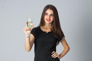 girl in black dress posing in studio photo