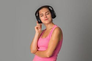 girl with headphones in studio photo