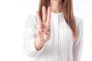 girl stretched forth a hand and three fingers shows close-up photo