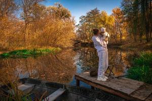 beautiful young mom with baby in autumn photo