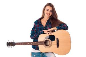 attractive brunette girl playing guitar photo