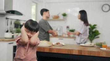 Domestic problem in family.The son use hands covering your feeling stressed from the parents quarrel. The child is having mental problems due to family problems. video