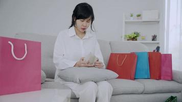 Women are feeling stressed because they don't have the money to pay off their credit card bills after making a huge purchase. Women owe credit card debt. debt concept video
