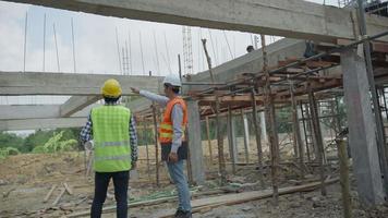 engineer pointed out the point mortar structure needs to be fixed. Inspector and contractor Discuss methods and solve building structure problems. Team construction recheck Actual. video