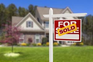 Sold Home For Sale Sign in Front of New House photo