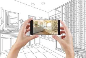 Hands Holding Smart Phone with Master Bathroom Photo on Screen and Drawing Behind