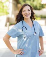 Young Adult Woman Doctor or Nurse Portrait Outside photo