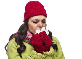 Sick Mixed Race Woman Blowing Her Sore Nose with Tissue photo